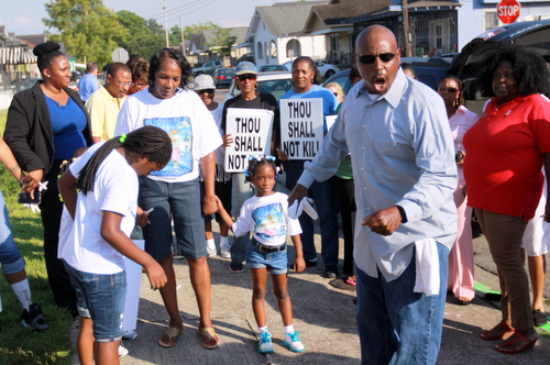 Family members, neighbors and supporters speak out in August 2014 for justice and against violence at a vigil for Anthony David Simon Jr., shot to death six months prior. (Robert Morris, UptownMessenger.com)