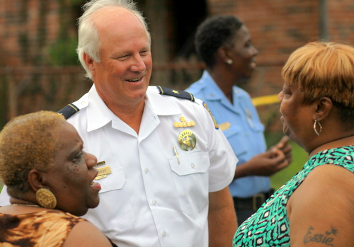 NOPD Sixth District Commander Bob Bardy and Barbara Lacen-Keller speak on a Central City sidewalk Wednesday. (Robert Morris, UptownMessenger.com)