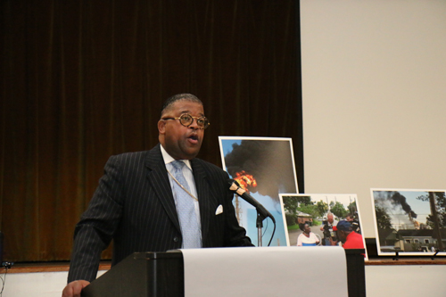 The Rev. Moses Gordon of speaks against the rebuilding of the Booker T. Washington High School atop a former waste dump at the GreenARMY Katrina commemoration at Xavier University. (Zach Brien for UptownMessenger.com)