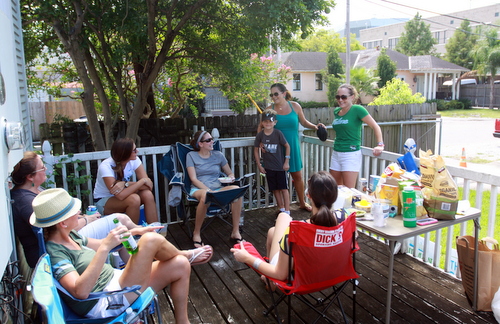 A group of "football wives of New Orleans" enjoys drinks on a back porch prior to the game. (Robert Morris, UptownMessenger.com)