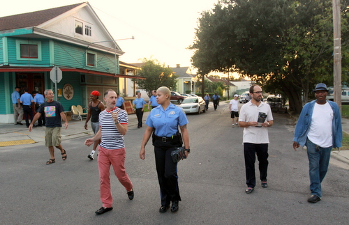 Detective Anya Hilliard talks to Delachaise Neighborhood Association member Will Winebrenner as they walk down Dryades Street on Wednesday evening. (Robert Morris, UptownMessenger.com)