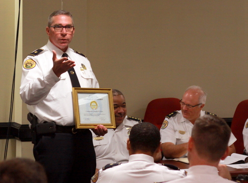 Commander Doug Eckert accepts his promotion to leader of the NOPD Crime Lab on Wednesday. (Robert Morris, UptownMessenger.com)