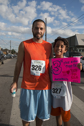Father and son duo, DJ and Caden Lewis, ran Saturday's 5K together. (Zach Brien, UptownMessenger.com)