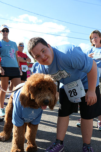 Alex Boudreaux poses with Maddox, a golden doodle with his own instagram following. (@NOLAdoodles) This was Alex Boudreaux's first 5K run/walk. (Zach Brien, UptownMessenger.com)