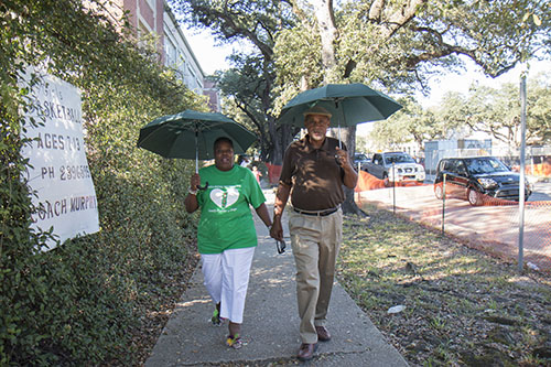 Joann and Noel Bradley walk hand-in-hand down Napoleon avenue Saturday afternoon as part of Helping Mothers Heal conference. (Zach Brien, UptownMessenger.com)