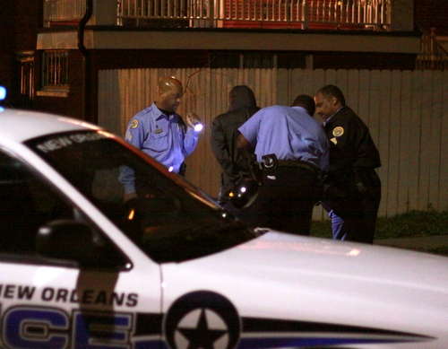 New Orleans police officers take a suspect into custody at the corner of Cadiz and Loyola streets during a two-hour manhunt in the area in January 2015 following a rash of Uptown robberies. (Robert Morris, UptownMessenger.com)