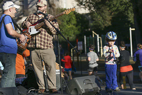 Cole Perrilliat, far right, plays trumpet with the Acadien Cajun band at the stage on St. Charles and Octavia. (Zach Brien, UptownMessenger.com)