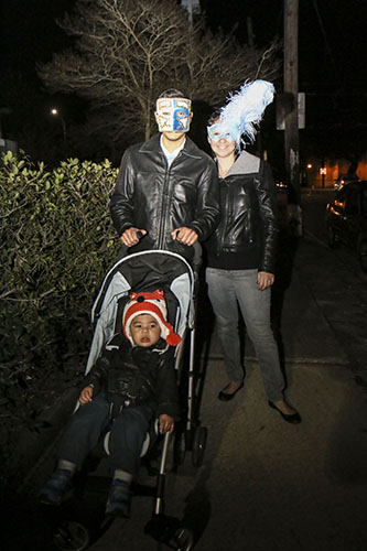 Ali, Valeri and Liam Bustamante head down Oak street to the barn. New to New Orleans, 2015 will be their first Mardi Gras. (Zach Brien, UptownMessenger.com)