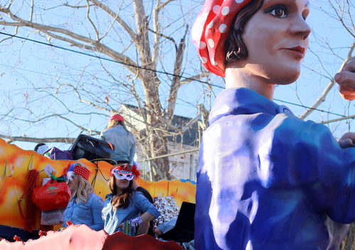 Riders strike a pose on the Krewe of Alla "Women at War" float on Magazine Street. (Robert Morris, UptownMessenger.com)