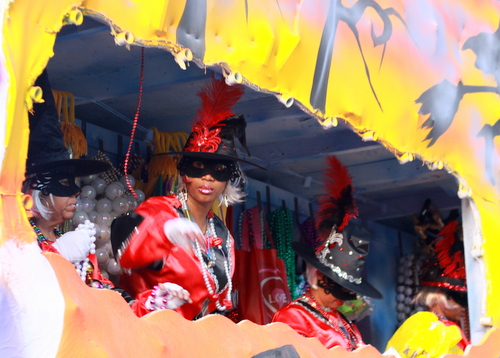 A rider on the Mystic Krewe of Femme Fatales' "Witches" float. (Robert Morris, UptownMessenger.com)