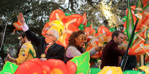 The cast of NCIS: New Orleans interacts with the crowd as they ride in the Krewe of Orpheus. (Robert Morris, UptownMessenger.com)