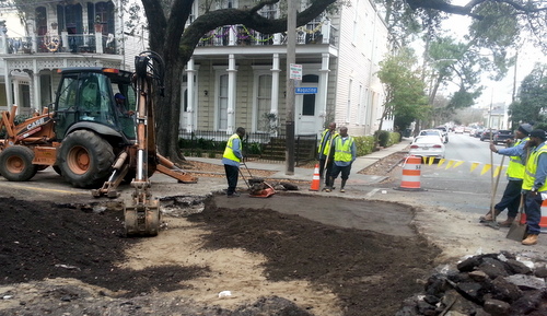 Workers patch up a section of Magazine Street on Friday afternoon after digging it up to find a sewer leak that shut down the street. (Robert Morris, UptownMessenger.com)