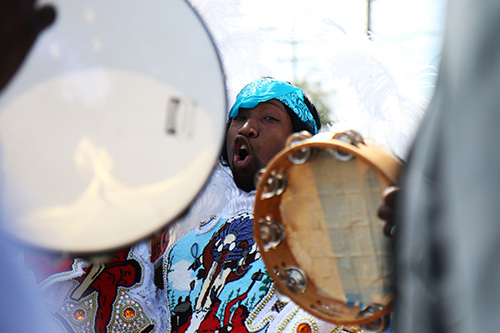 Big Chief Juan Pardo of the Golden Comanches sings with other indians on the corner of Fourth and LaSalle. (Zach Brien, UptownMessenger.com)