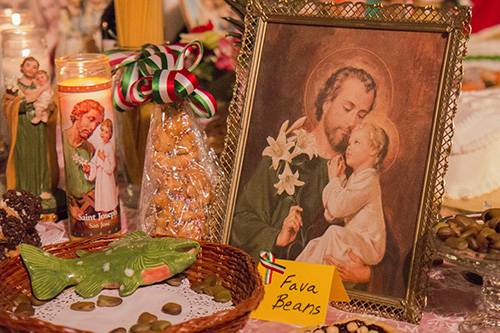 An offering of fava beans in front of an image of St. Joseph at the altar in St. Stephen's Church on Napoleon. It is said that the fava bean was used by St. Joseph to save Sicily from famine in the Middle Ages. (Zach Brien, UptownMessenger.com)
