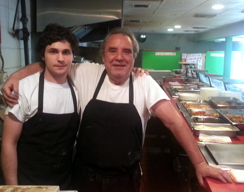 Chef Antonino "Nino" Bongiorno and his son, Giuseppe, behind the counter at Cafe Nino. The restaurant will close May 31. (Robert Morris, UptownMessenger.com)
