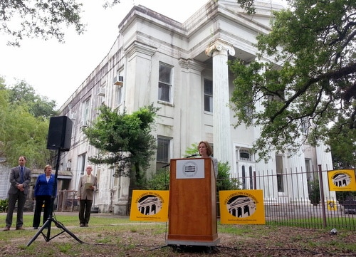Sandra Stokes of the Louisiana Landmarks Society speaks in front of the Carrollton Courthouse on Wednesday, June 24. (Robert Morris, UptownMessenger.com)