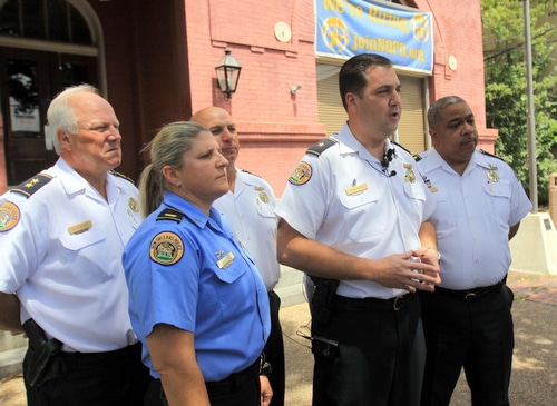 NOPD leadership -- from left, Deputy Chief Bob Bardy, Second District Lt. Jennifer Dupree, Sixth District Commander Ronnie Stevens, Second District Commander Paul Noel, and Chief Michael Harrison -- discuss recent Uptown armed robberies on Tuesday. (Robert Morris, UptownMessenger.com)