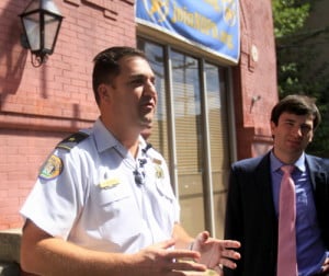 NOPD Second District Commander Paul Noel and NOPD spokesman Tyler Gamble discuss the investigation into the latest Uptown armed robbery on Wednesday morning in front of the district station. (Robert Morris, UptownMessenger.com)