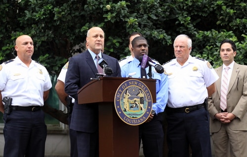 Flanked by NOPD officials, Mayor Mitch Landrieu speaks at a news conference Monday afternoon. (Robert Morris, UptownMessenger.com)