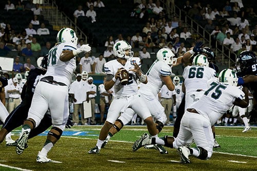 Quarterback Tanner Lee steps up in the pocket to make a throw. Lee threw for 277 yards and a score in Saturday's match. (Zach Brien, UptownMessenger.com)