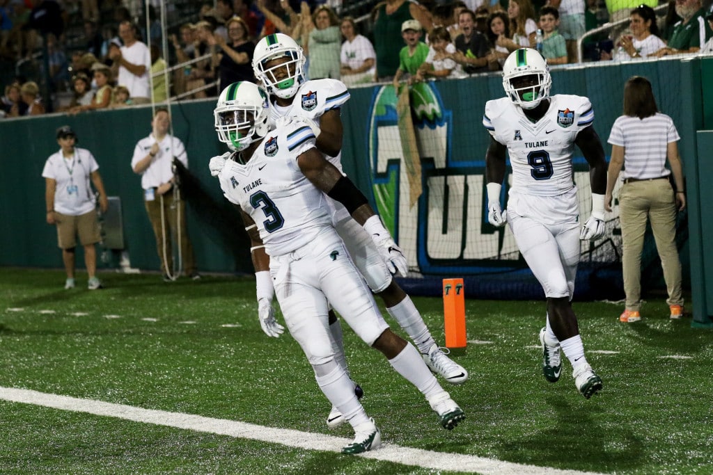 Running back Sherman Badie celebrates his 56-yard touchdown with wide receiver Larry Darce. Badie rushed for 71 yards and a touchdown. (Zach Brien, UptownMessenger.com)