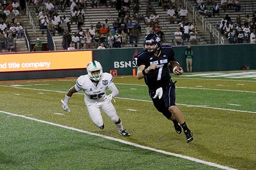 Tulane linebacker Nico Marley, left, flushes Maine quarterback Dan Collins out of the pocket. (Zach Brien, UptownMessenger.com)