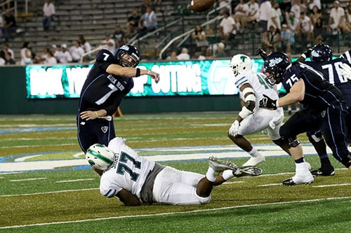 Tulane defensive tackle Tanzel Smart hits Maine quarterback Dan Collins as he releases the ball. (Zach Brien, UptownMessenger.com)