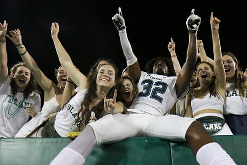 Stephon Lofton, red shirt freshman corner back, celebrates Saturday's win with students in the student section of Yulman Stadium. Tulane beat Maine 38-7. (Zach Brien, UptownMessenger.com)