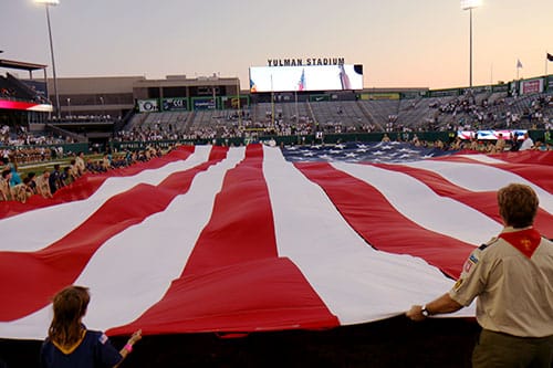 Area boy scout troops presented the American flag during the national anthem before Saturday's game.