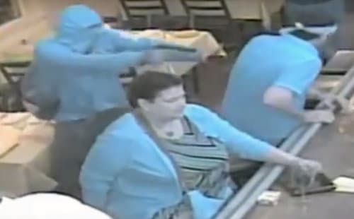 An image from the security videos at Patois. Detectives note that the infrared video changes the colors in the video, and that the turquoise clothing is actually shown as near-black in normal light. (image via NOPD)
