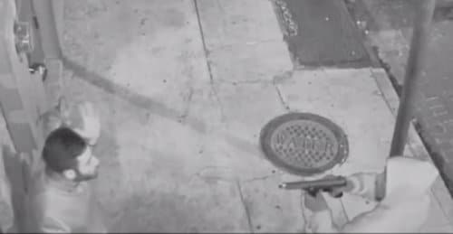 Peter Gold tries to talk to a man now identified as 21-year-old Euric Cain on Friday, Nov. 20, moments before Cain shot Gold. (still image from surveillance video released by NOPD)