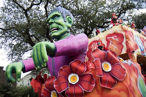 Krewe of King Arthur's "Employment" float featured a mock advertisement, reading "Looking for wait staff, cook, hostesses. Must have background in martial arts and/or concealed carry. Military training a plus. Bullet proof vests provided." King Arthur was one of four parades that rolled uptown on Sunday. (Zach Brien, UptownMessenger.com)