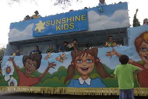 The Sunshine Kids float of the Krewe of Alla rolls down Napoleon Avenue. The Krewe of Alla was one of four parades to roll Sunday afternoon Uptown. (Zach Brien, UptownMessenger.com)