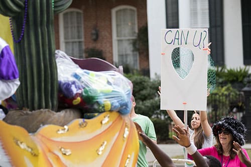 Brenda Ware, bottom right, challenges riders on the "Texas, the _ _ N_ S_ _R State" float in the Krewe of Pontchartrain. The Krewe was one of five parades rolling Uptown on Saturday. (Zach Brien, UptownMessenger.com)