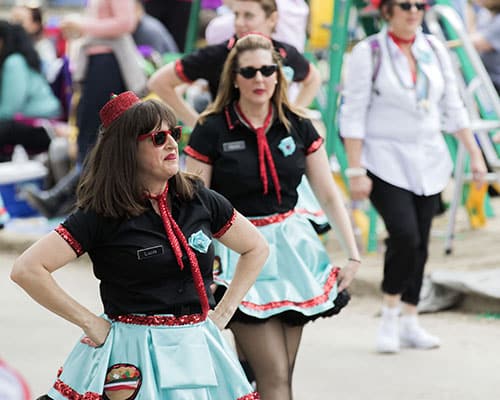 Dancers with the Muff-a-lotta dance troupe make their way down Napoleon avenue in the Krewe of Pontchartrain. The Krewe was one of five parades rolling Uptown on Saturday. (Zach Brien, UptownMessenger.com)