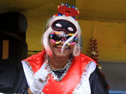 A rider smiles as the Mystic Krewe of Femme Fatale rolls on St. Charles Avenue. (Robert Morris, UptownMessenger.com)