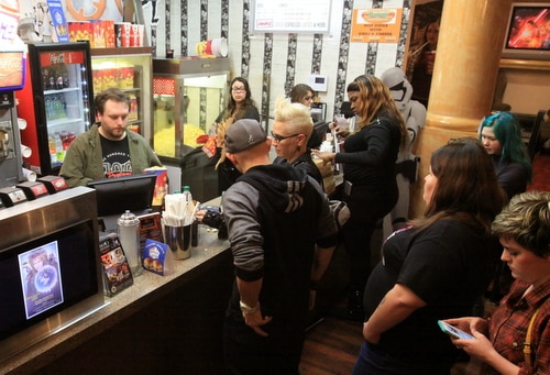A digital poster for "Labyrinth" displays while moviegoers order popcorn in the lobby. (Robert Morris, UptownMessenger.com)