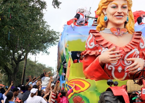 Crowds throng the Dollywood float as the Mystic Krewe of Femme Fatale rolls on St. Charles Avenue. (Robert Morris, UptownMessenger.com)