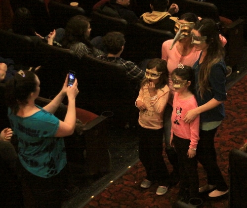 A group of fans pose for a photo in masks as they wait for "Labyrinth" to begin. (Robert Morris, UptownMessenger.com)