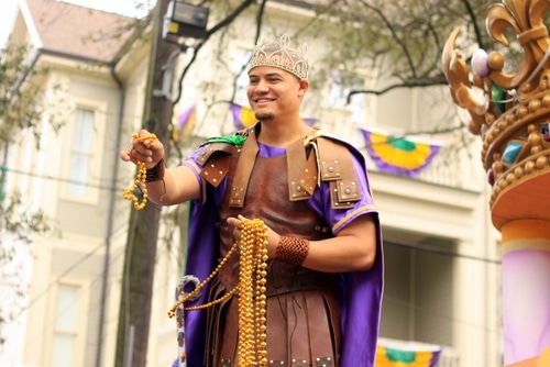 Bivian "Sonny" Lee III rides as this year's king of the Krewe of Freret parade on Napoleon Avenue. (Robert Morris, UptownMessenger.com)