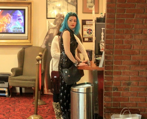 A fan named Jackie O waits for a last minute coffee before the beginning of Labyrinth. (Robert Morris, UptownMessenger.com)