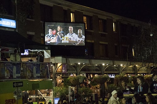 Superior Grill, near the corner of St. Charles avenue and Amelia street, projected the Super Bowl onto a screen so people at Bacchus would not miss the game. Bacchus 2016 rolled with the theme "Flights of Delight." (Zach Brien, UptownMessenger.com)