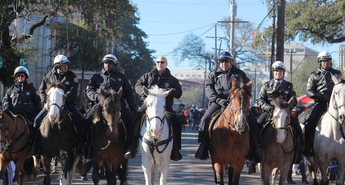Mayor Mitch Landrieu, NOPD Superintendent Michael Harrison and other police officers ride on horseback in front of the Krewe of Zulu parade on Mardi Gras day, Feb. 9, 2016. (Robert Morris, UptownMessenger.com)