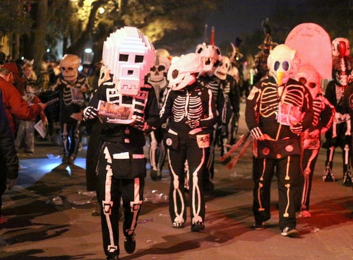 The Skeleton Krewe hands out newspapers as Le Krewe d'Etat rolls on Napoleon Avenue. (Robert Morris, UptownMessenger.com)