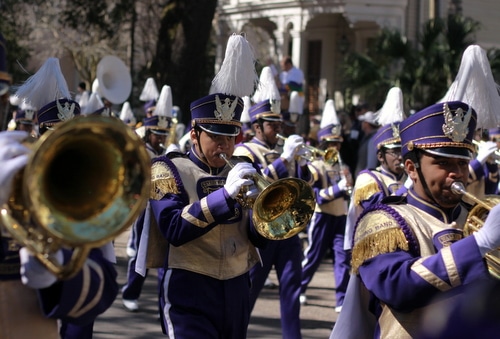 The Warren Easton marching band performs as the Krewe of Rex rolls on St. Charles Avenue. (Robert Morris, UptownMessenger.com)