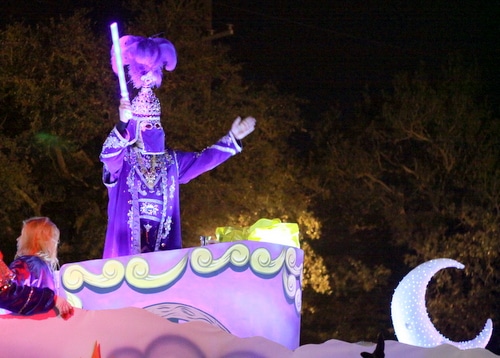 The captain signals to the crowd as the Krewe of Morpheus rolls on Magazine Street. (Robert Morris, UptownMessenger.com)