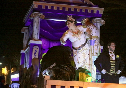 The queen tosses throws as the Krewe of Morpheus rolls on Magazine Street. (Robert Morris, UptownMessenger.com)
