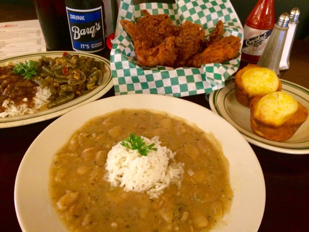 Willie Mae's Grocery & Deli's Butterbeans & Rice, Fried Chicken, Corn Muffins, and Seasoned Greens with Rice and Gravy (Kristine Froeba)