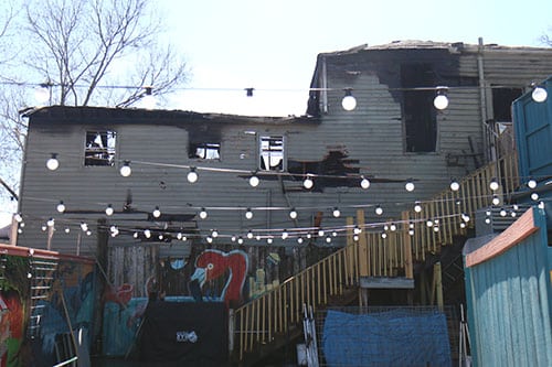 A four-alarm fire set off early Saturday morning. The fire damaged severely two homes on Louisiana avenue near Constance Street. (Zach Brien, UptownMessenger.com)