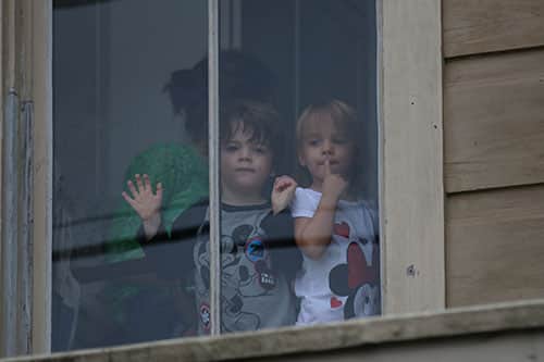 Children watch the 66th annual Irish Channel St. Patrick's Day Parade from a balcony window on Magazine street on Saturday, March 12. (Zach Brien, UptownMessenger.com)